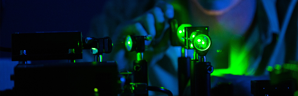 Laser beam shining through lenses