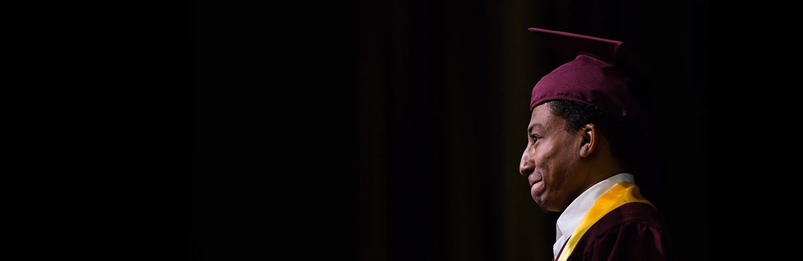 ASU graduating student wearing a cap and gown